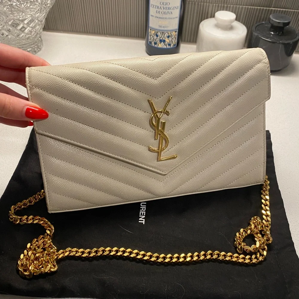 Yves Saint Laurent Ivory Quilted Crossbody with Gold Accents
Lightly used - Picture 5 of 6